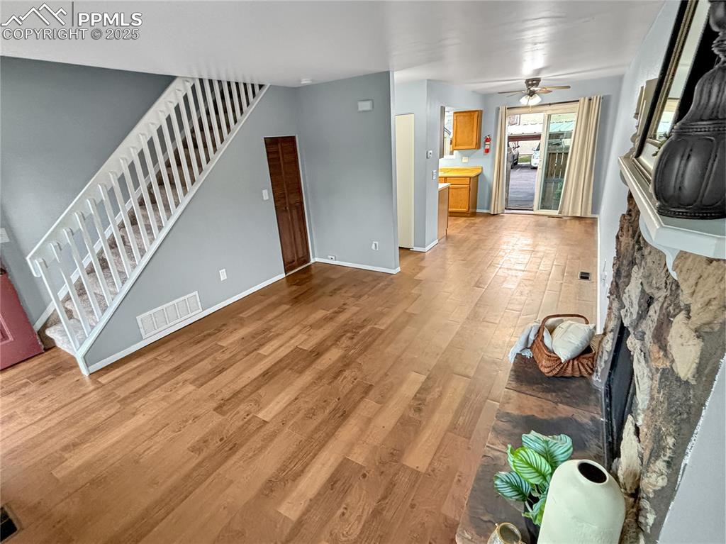 3033 Starlight Circle Colorado Springs, CO 80916 - Photo 17 of 44 a view of entryway and hall with wooden floor