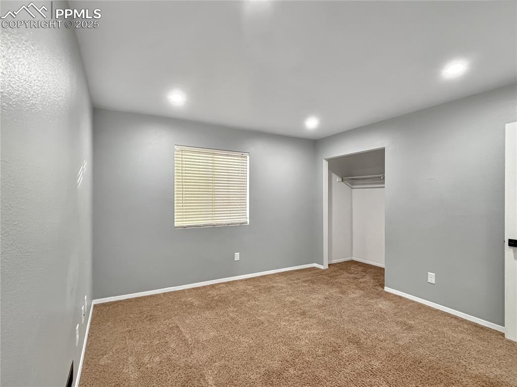 3033 Starlight Circle Colorado Springs, CO 80916 - Photo 27 of 44 an empty room with windows