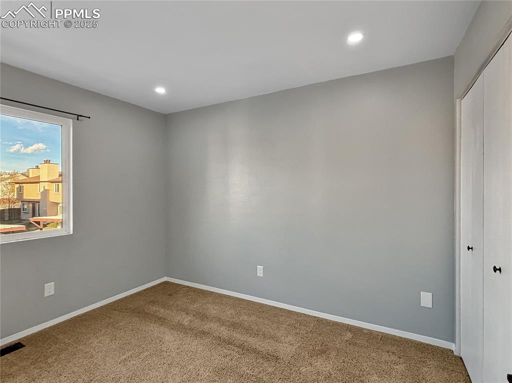 3033 Starlight Circle Colorado Springs, CO 80916 - Photo 29 of 44 an empty room with windows
