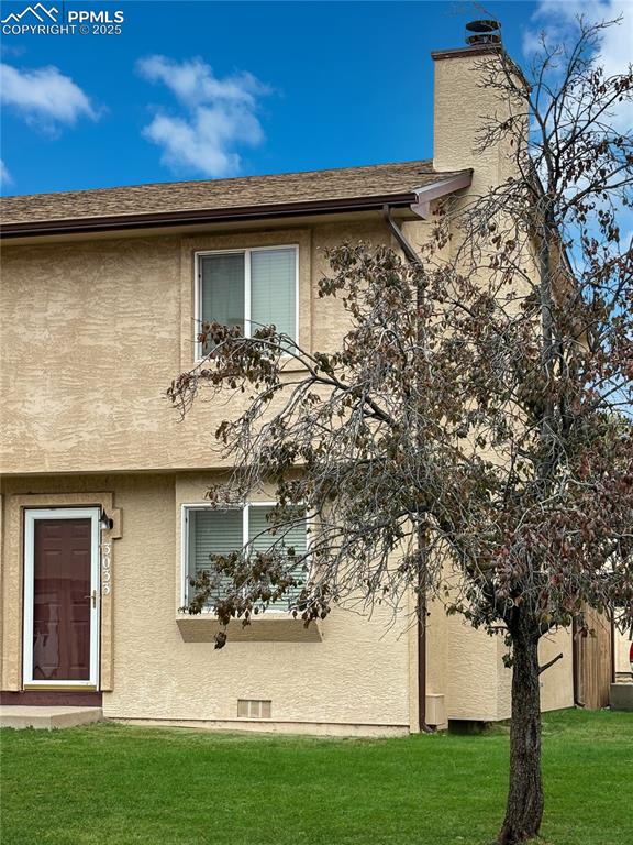 3033 Starlight Circle Colorado Springs, CO 80916 - Photo 31 of 44 a view of a house with a yard