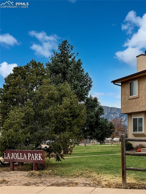 3033 Starlight Circle Colorado Springs, CO 80916 - Photo 36 of 44 a view of a street with a building in the background