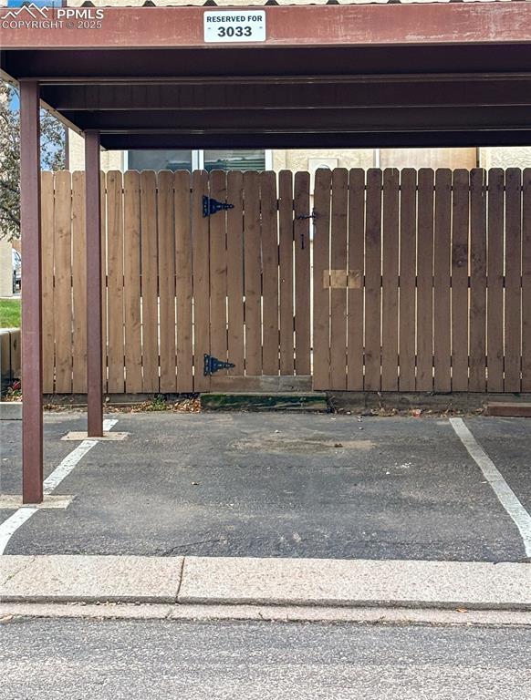 3033 Starlight Circle Colorado Springs, CO 80916 - Photo 38 of 44 a view of a house with a wooden fence