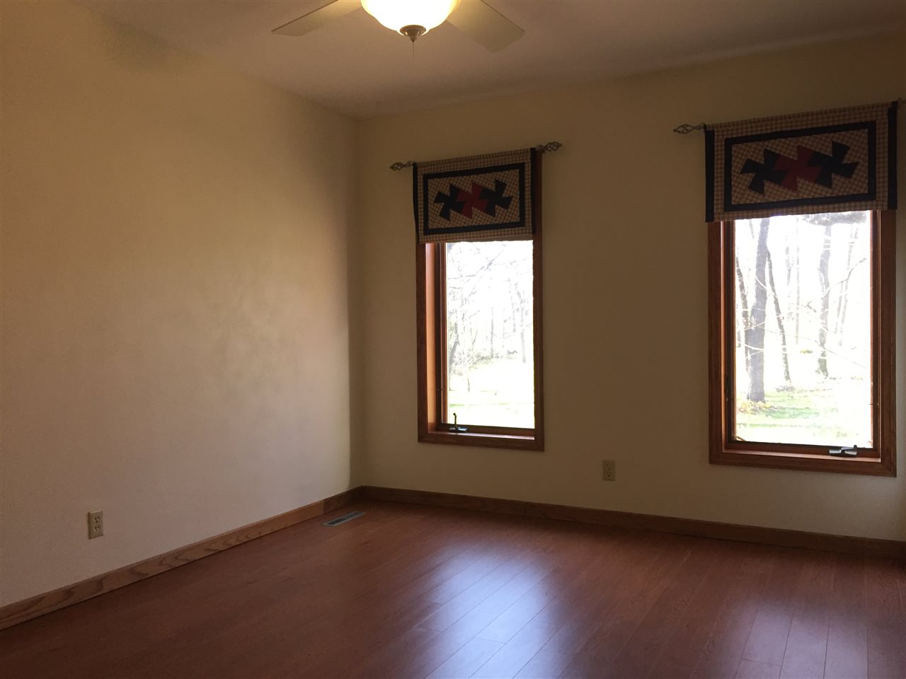 3275 North Meridian Road Stillman Valley, IL 61084 - Photo 18 of 24 an empty room with wooden floor and windows