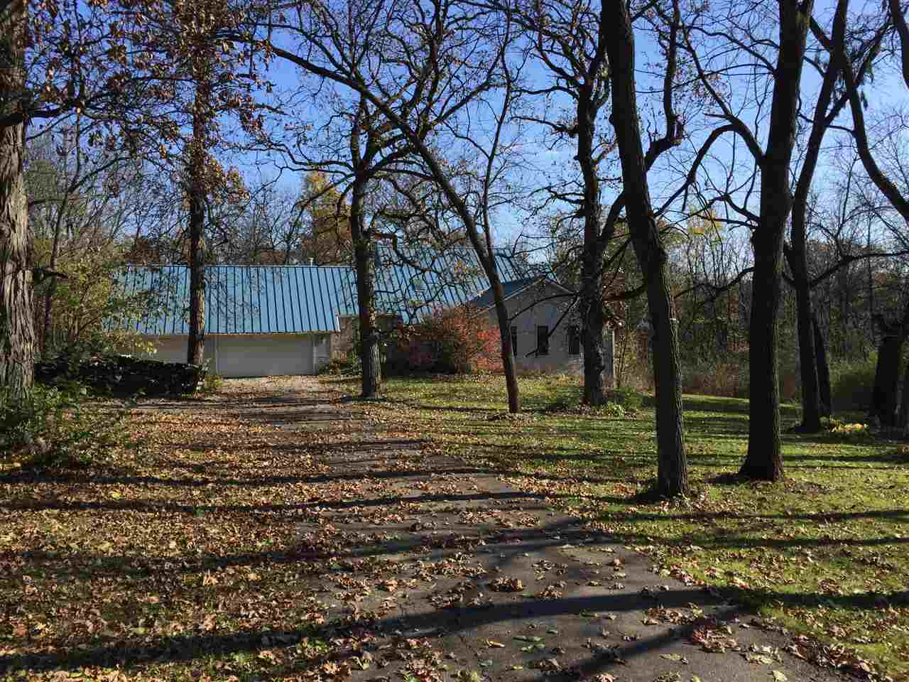 3275 North Meridian Road Stillman Valley, IL 61084 - Photo 2 of 24 a view of a yard with a large tree