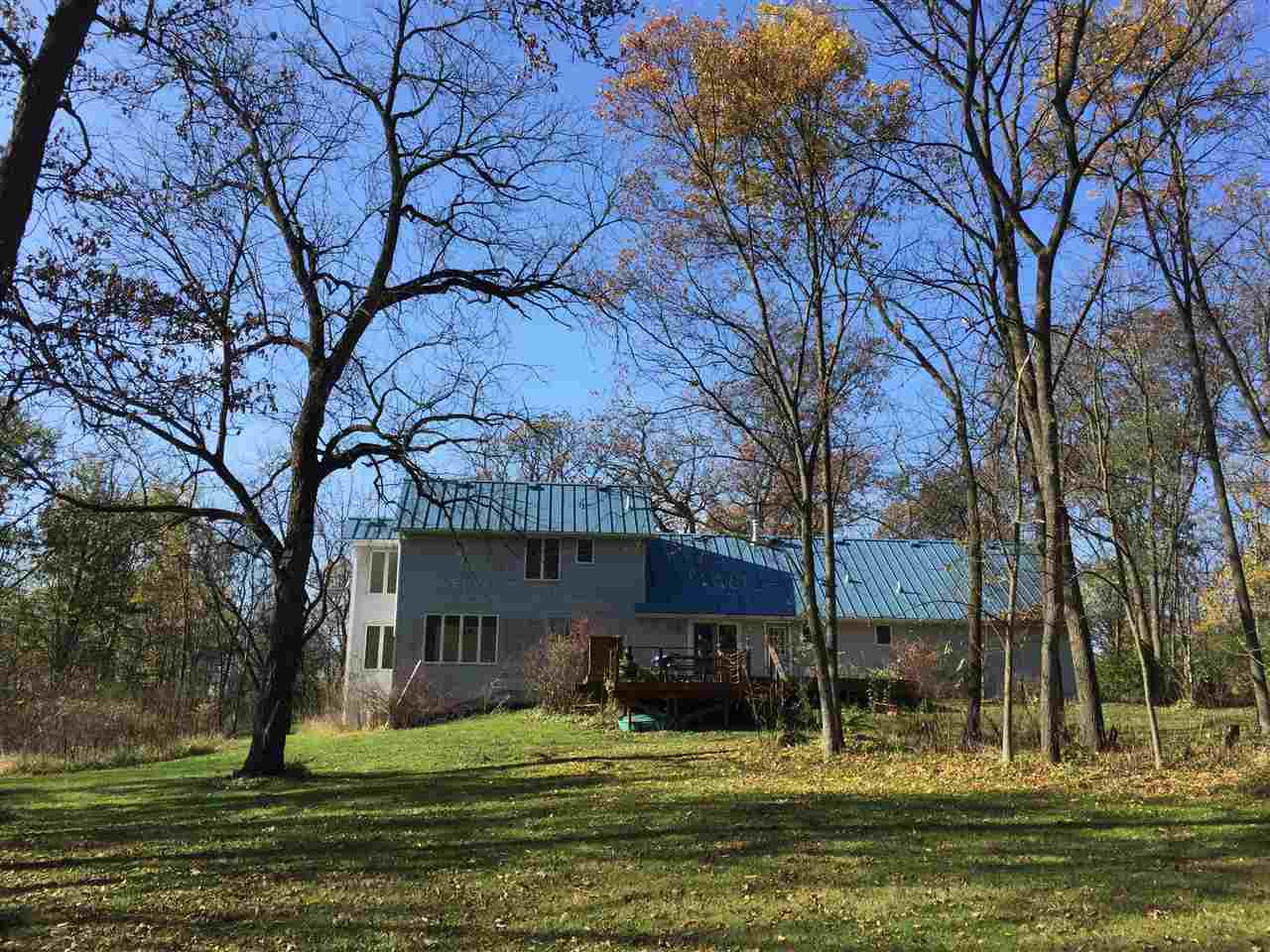 3275 North Meridian Road Stillman Valley, IL 61084 - Photo 7 of 24 a house view with a swimming pool in front of house