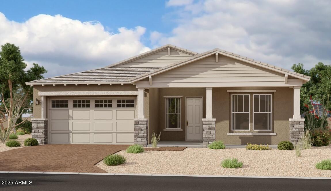 a front view of a house with a garage