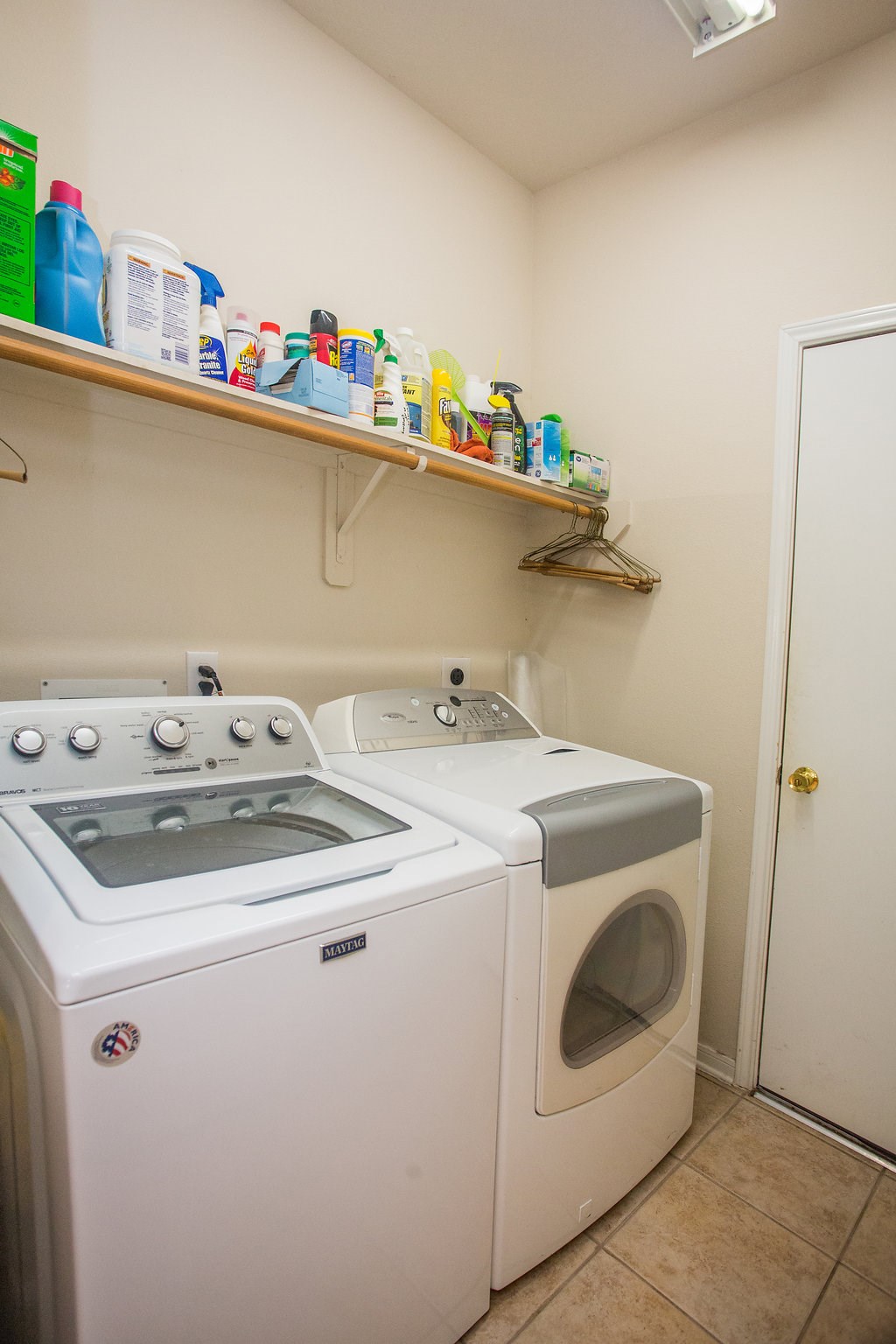 2930 Westerfield Lane Houston, TX 77084 - Photo 11 of 22 Laundry room with shelving for additional storage. The washer and dryer will stay.
