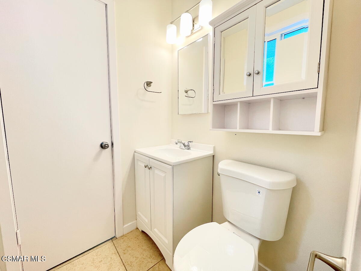 6334 Caroline Avenue Simi Valley, CA 93063 - Photo 13 of 30 a white toilet sitting next to a bathroom sink