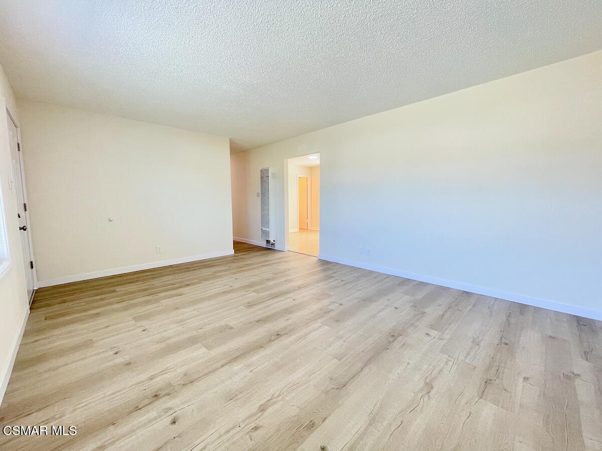 6334 Caroline Avenue Simi Valley, CA 93063 - Photo 7 of 30 a view of an empty room and wooden floor