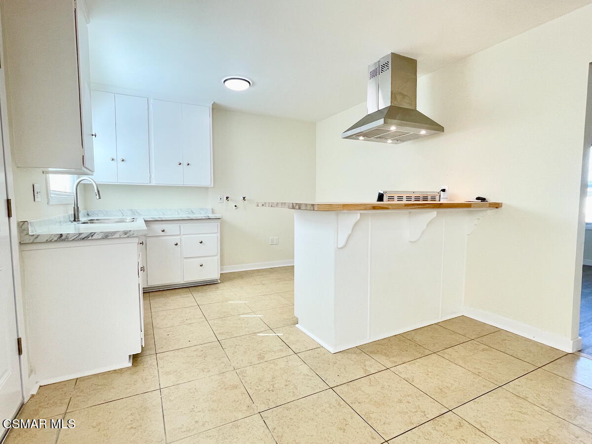 6334 Caroline Avenue Simi Valley, CA 93063 - Photo 9 of 30 a kitchen with a sink cabinets and appliances