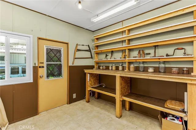 a living room with a bed and a window