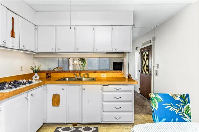 a kitchen with a stove and cabinets