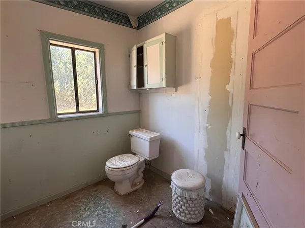 a livingroom with furniture and a stove
