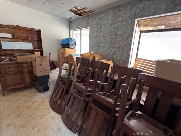 a room with furniture a rug and a window