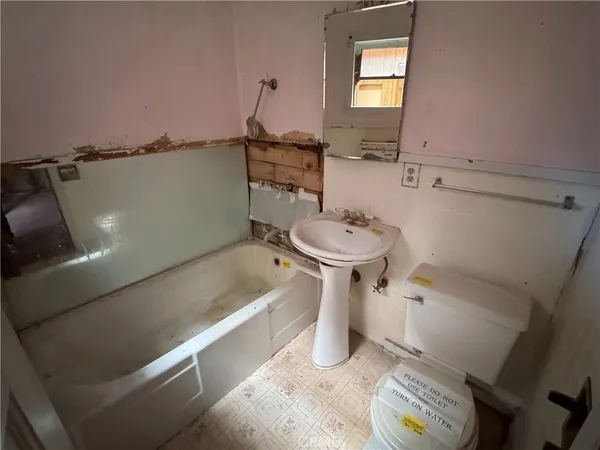 a living room with furniture gym equipment and a view of living room