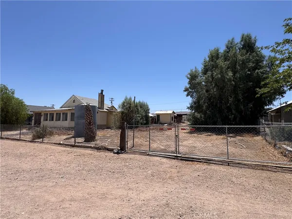 a kitchen with a stove cabinets and window
