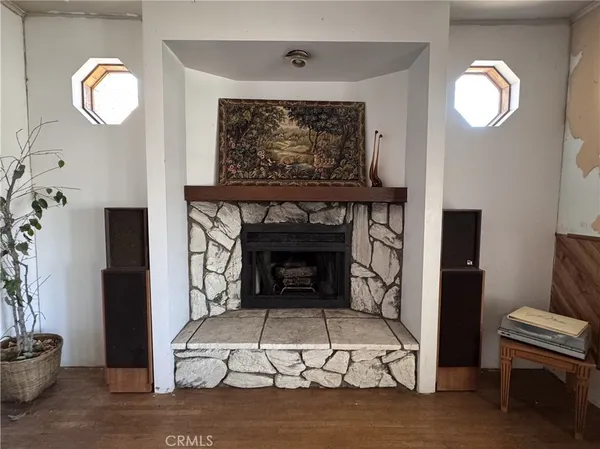 a view of a balcony with wooden floor