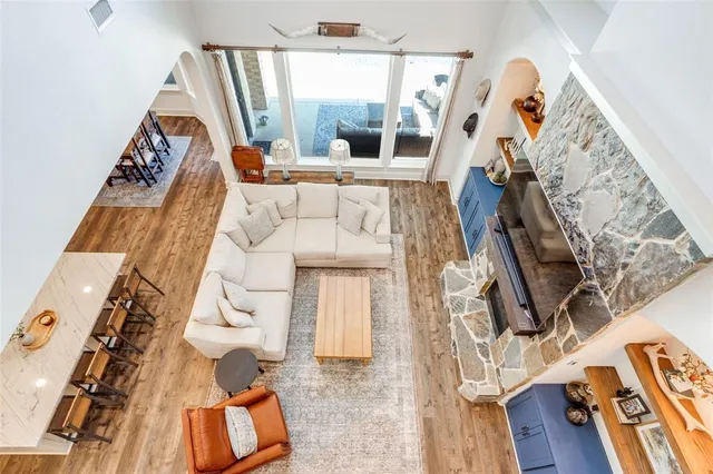 a view of a room with furniture and wooden floor