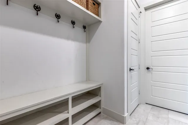 a bedroom with furniture and a large window