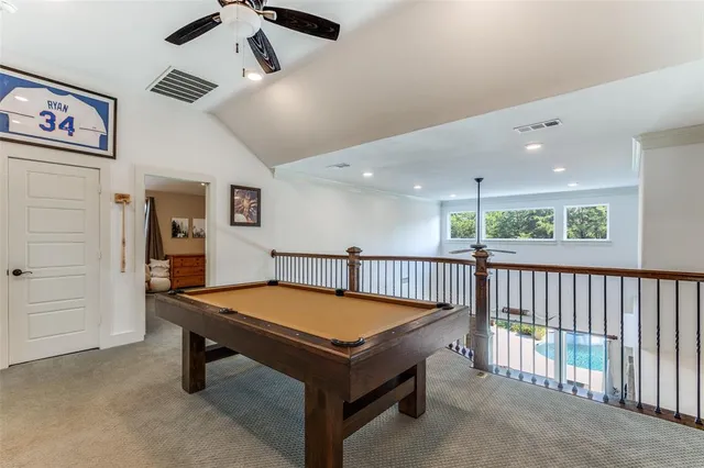 a bathroom with a granite countertop bathtub shower and toilet