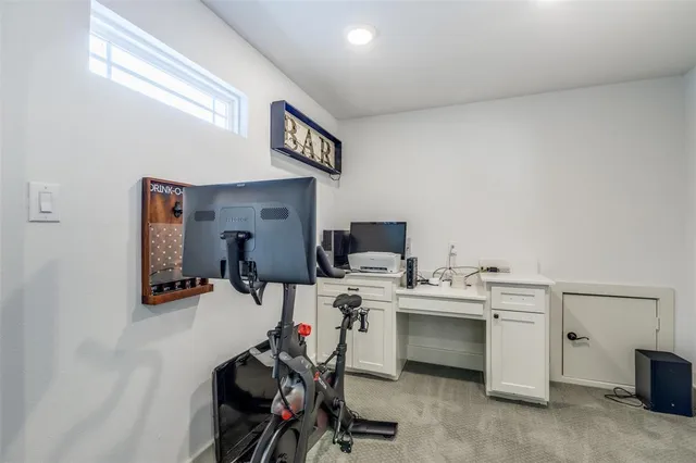 a room with pool table and a ceiling fan