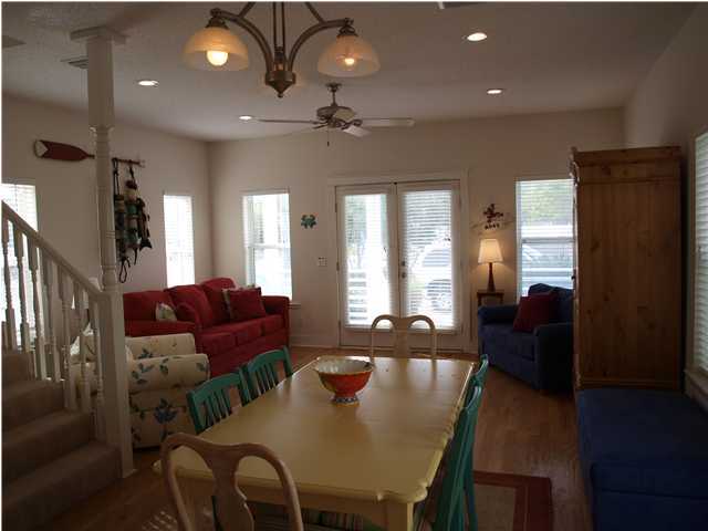 60 Brown Street Santa Rosa Beach, FL 32459 - Photo 4 of 17 a view of a dining room with furniture and wooden floor