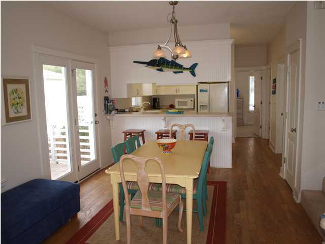 60 Brown Street Santa Rosa Beach, FL 32459 - Photo 7 of 17 a view of a dining room with furniture window and wooden floor