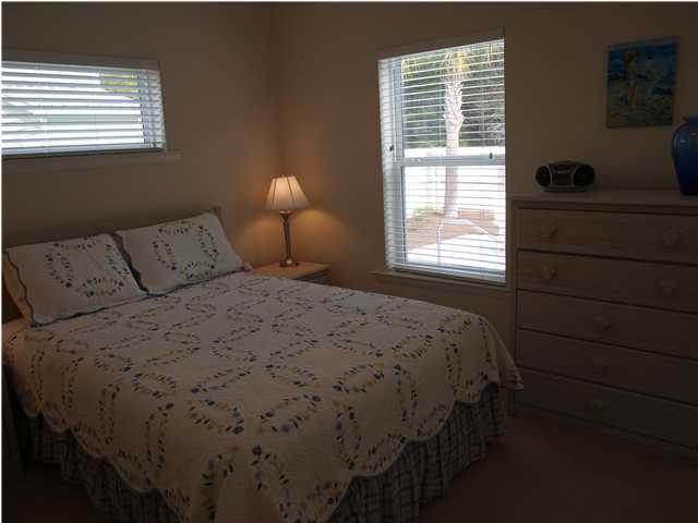 60 Brown Street Santa Rosa Beach, FL 32459 - Photo 8 of 17 a bedroom with a bed and a window