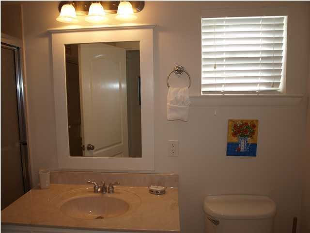 60 Brown Street Santa Rosa Beach, FL 32459 - Photo 9 of 17 a bathroom with a sink and a mirror