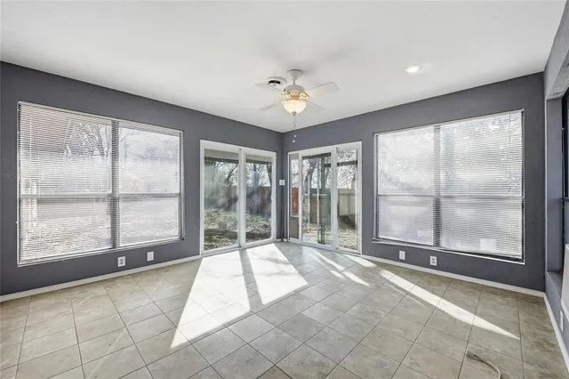 a view of an entryway with wooden floor and windows