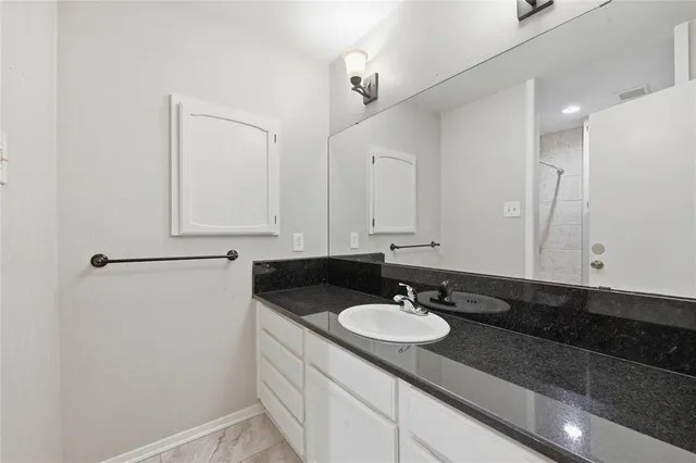 a white toilet sitting next to a bath tub