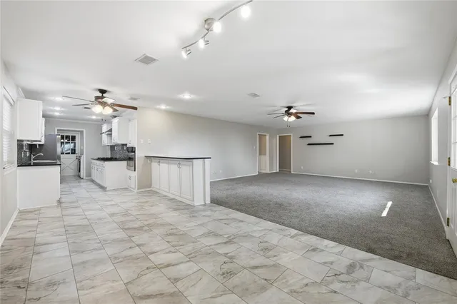 a view of empty room with windows