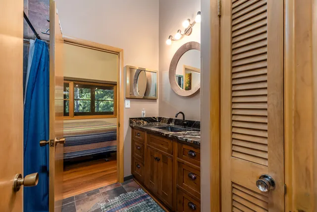 a kitchen with a stove and a window