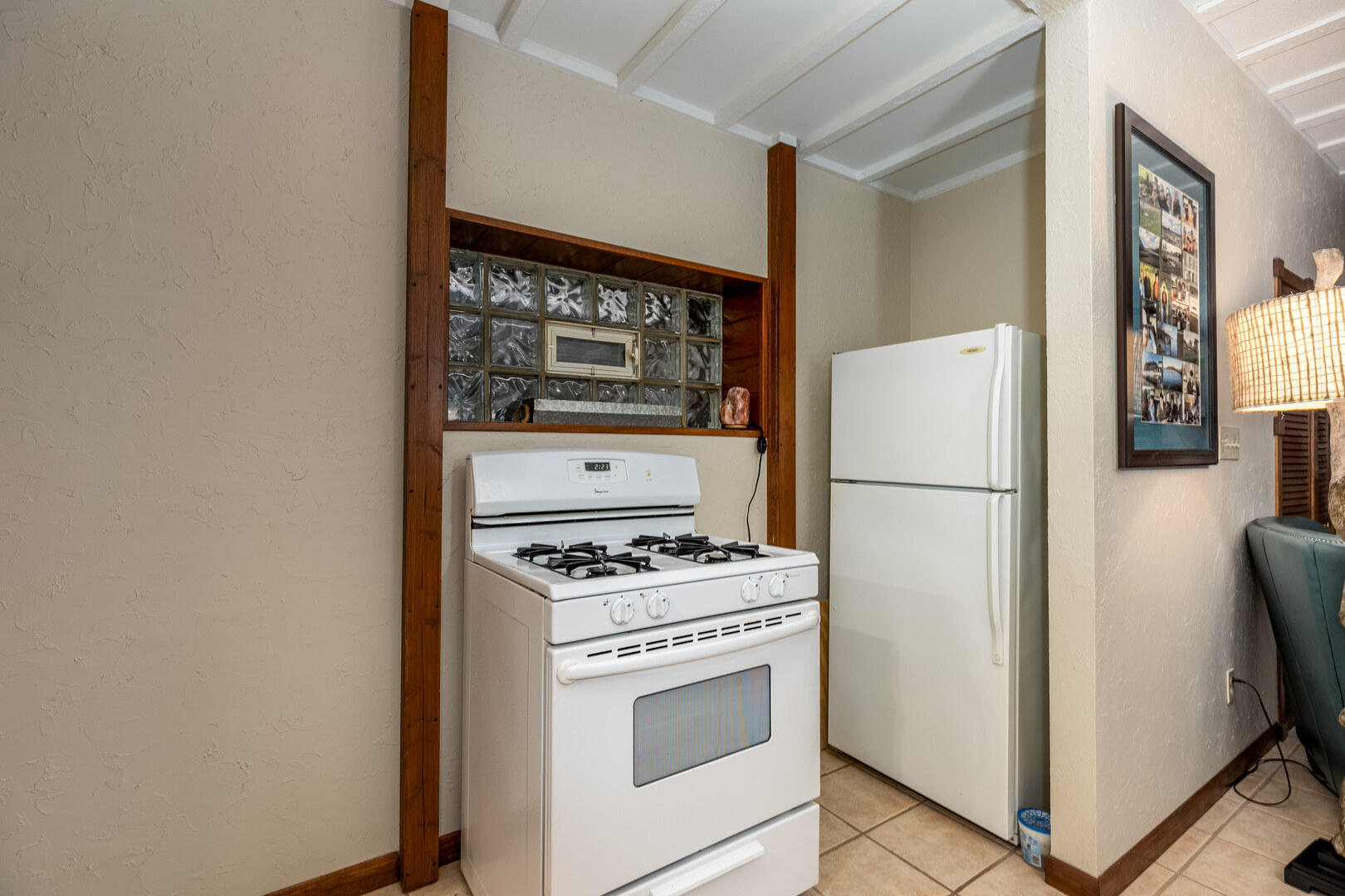 4010 East 1950th Road Sheridan, IL 60551 - Photo 22 of 42 a kitchen with a refrigerator stove and white cabinets