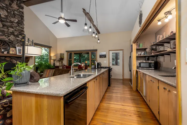 a kitchen with stainless steel appliances granite countertop counter space a sink and cabinets