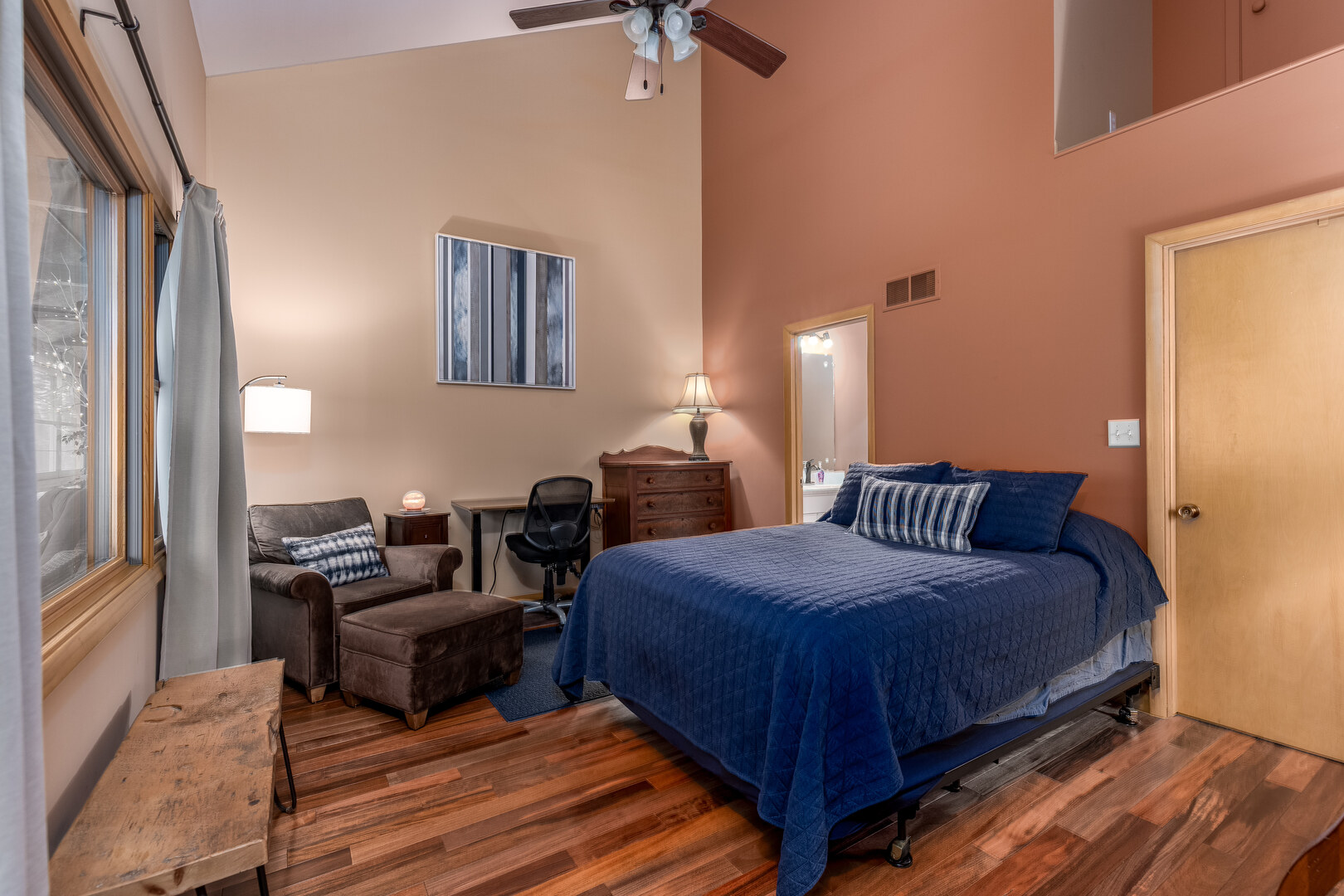 4010 East 1950th Road Sheridan, IL 60551 - Photo 10 of 42 a bedroom with bed and a chandelier