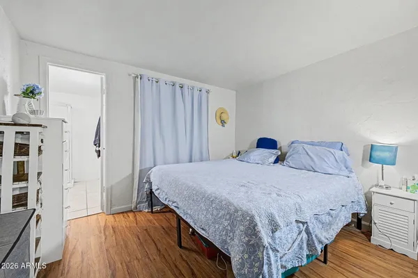 a bedroom with a bed and a cabinets