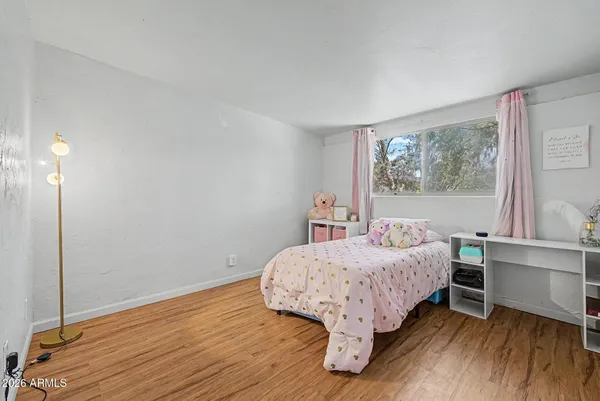 a bedroom with a bed and closet