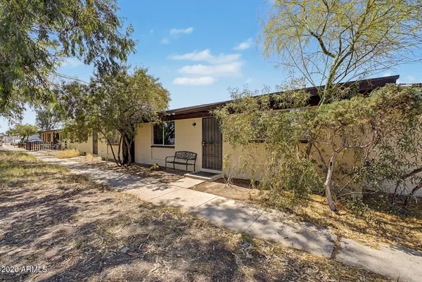 a view of a backyard of the house