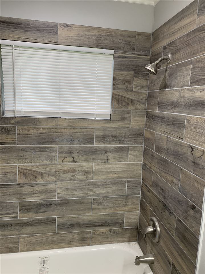 4861 Quince Road Memphis, TN 38117 - Photo 12 of 14 Updated bathrooms with beautiful, modern tile finishes