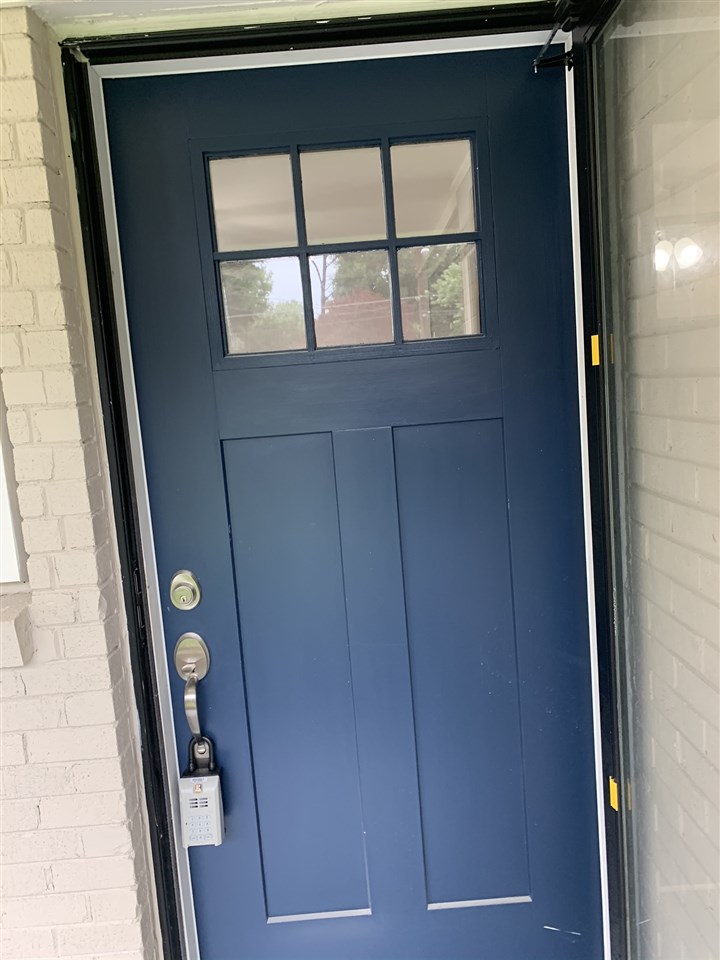 4861 Quince Road Memphis, TN 38117 - Photo 3 of 14 Blue door adds a pop of color to the front of the home