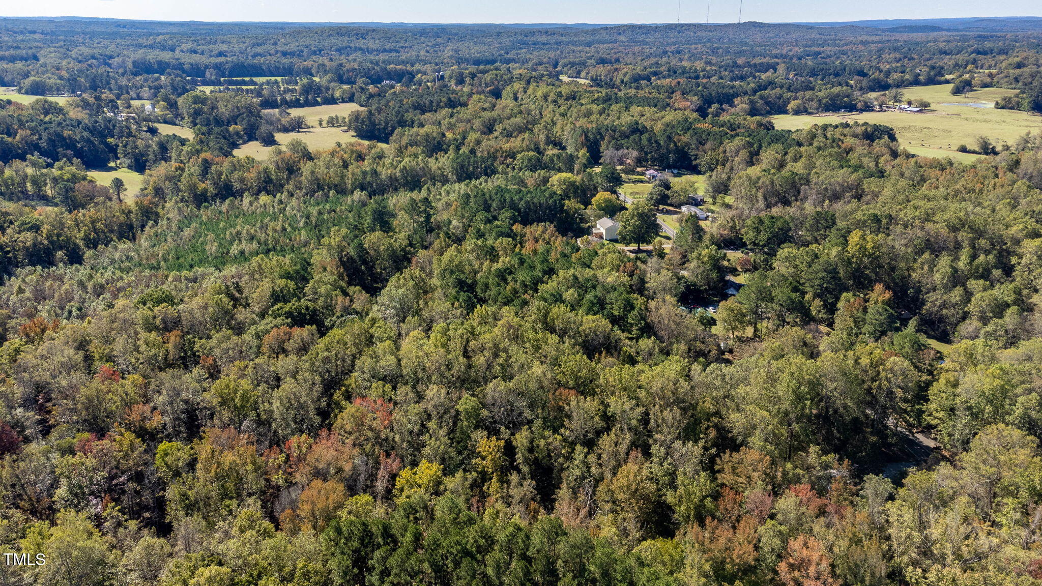 0 Neville Road Chapel Hill, NC 27516 - Photo 15 of 22 an aerial view of a houses with a lush green hillside