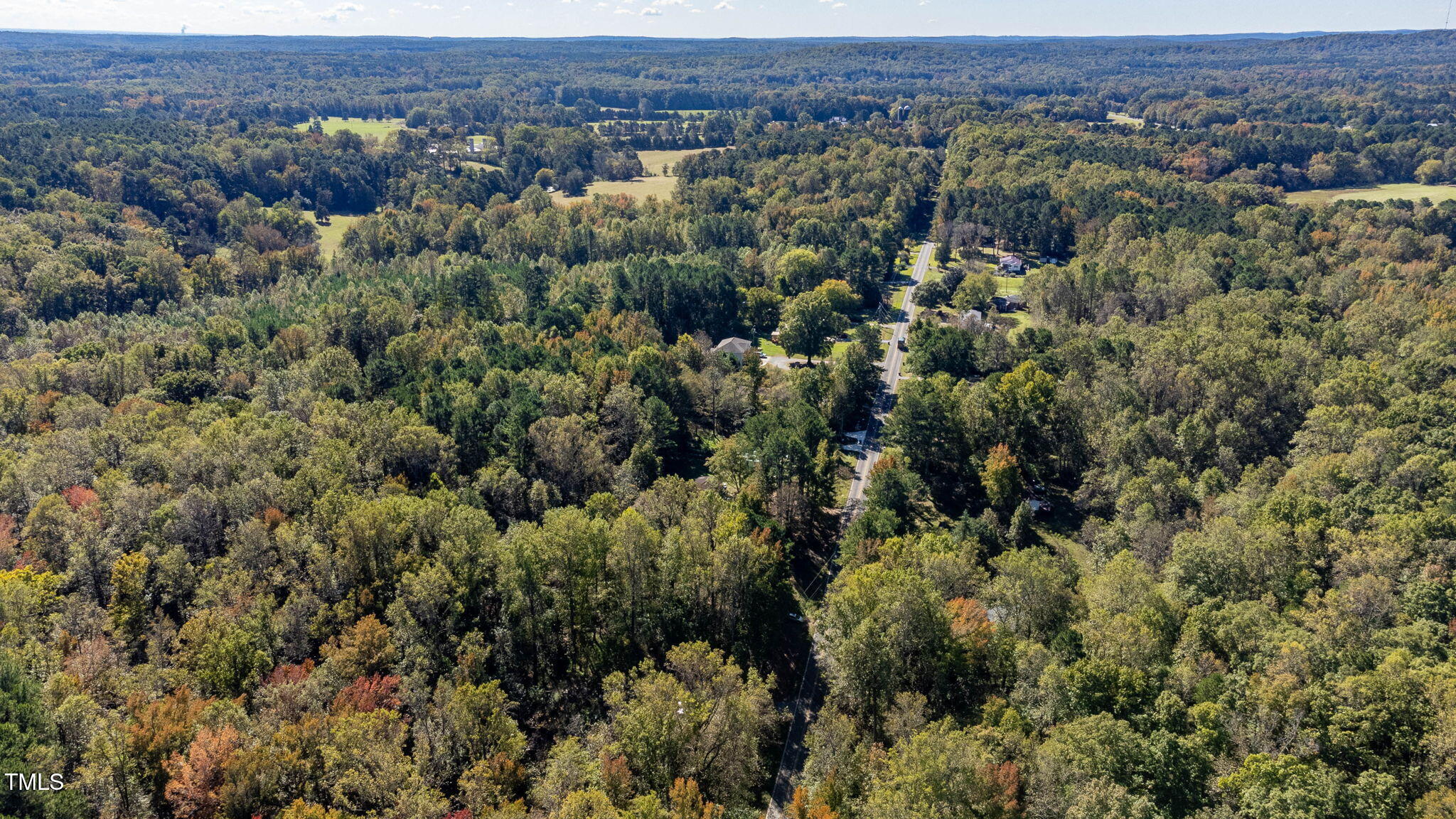 0 Neville Road Chapel Hill, NC 27516 - Photo 8 of 22 an aerial view of a houses with a lush green hillside