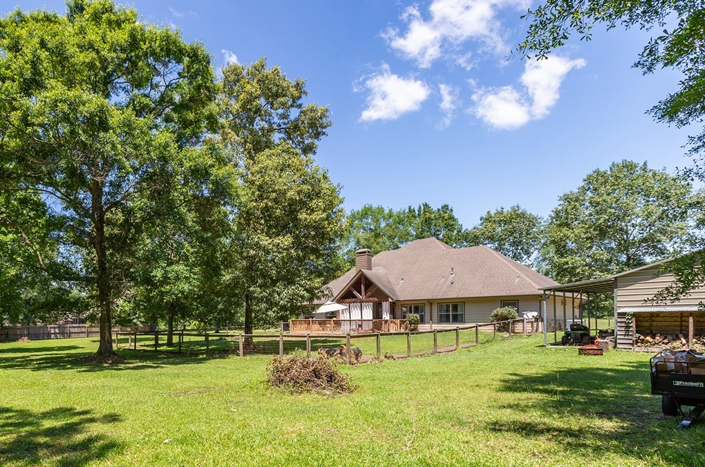 1171 Old Ewing Road Lufkin, TX 75901 - Photo 35 of 49 a front view of a house with garden