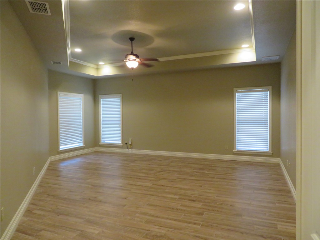 5803 South Oso Parkway Corpus Christi, TX 78414 - Photo 17 of 39 a view of an empty room with window and wooden floor