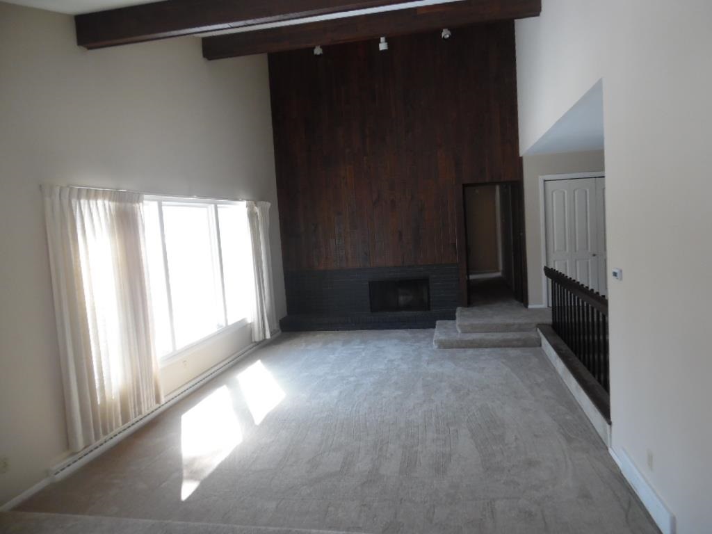 4951 Brookview Road Rockford, IL 61107 - Photo 5 of 19 a view of empty room with a fireplace
