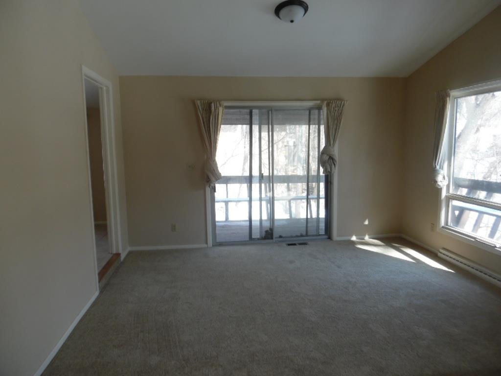 4951 Brookview Road Rockford, IL 61107 - Photo 6 of 19 an empty room with windows