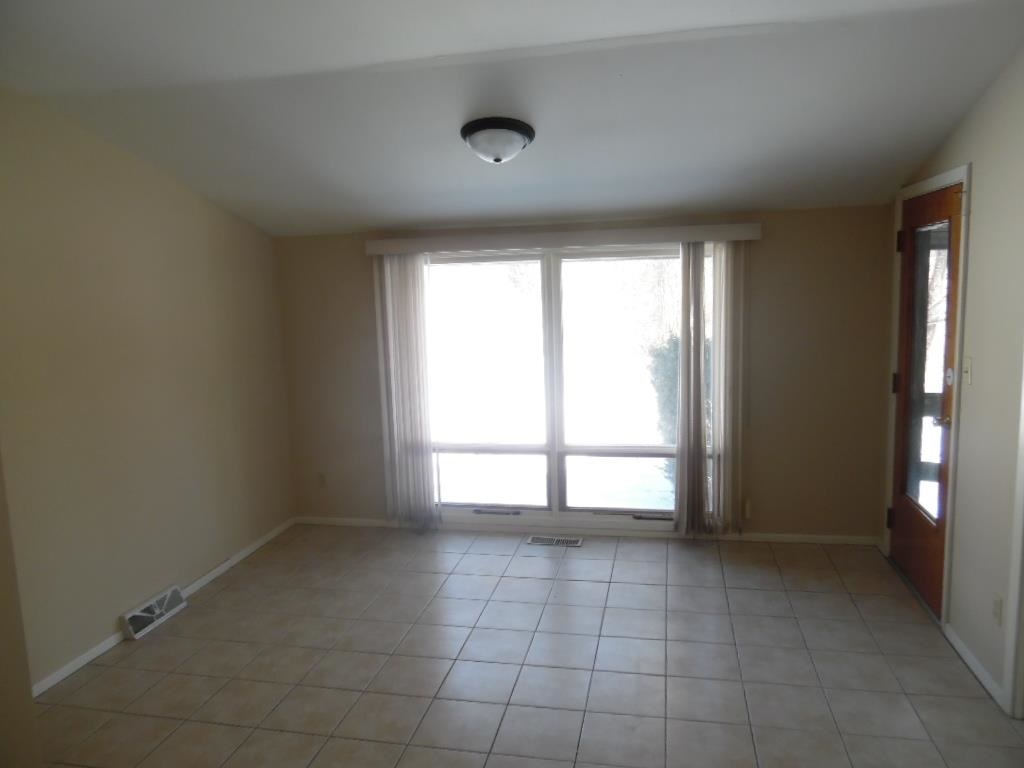 4951 Brookview Road Rockford, IL 61107 - Photo 7 of 19 a view of an empty room with a window
