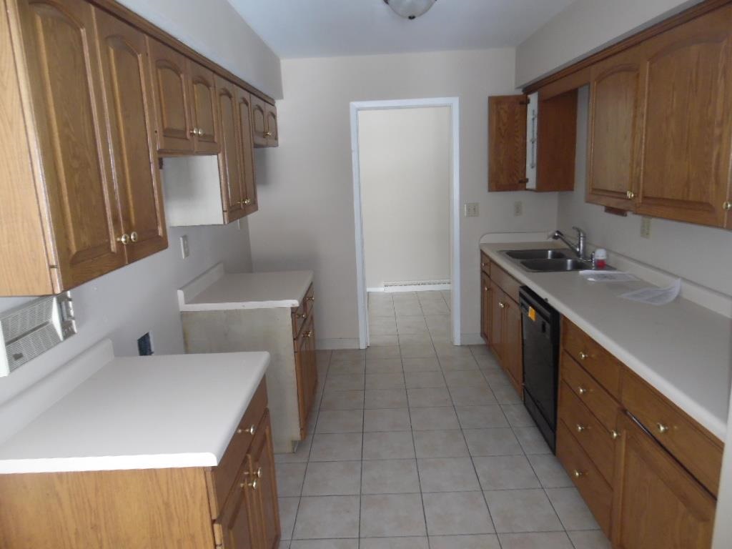 4951 Brookview Road Rockford, IL 61107 - Photo 8 of 19 a kitchen with a sink stove and cabinets