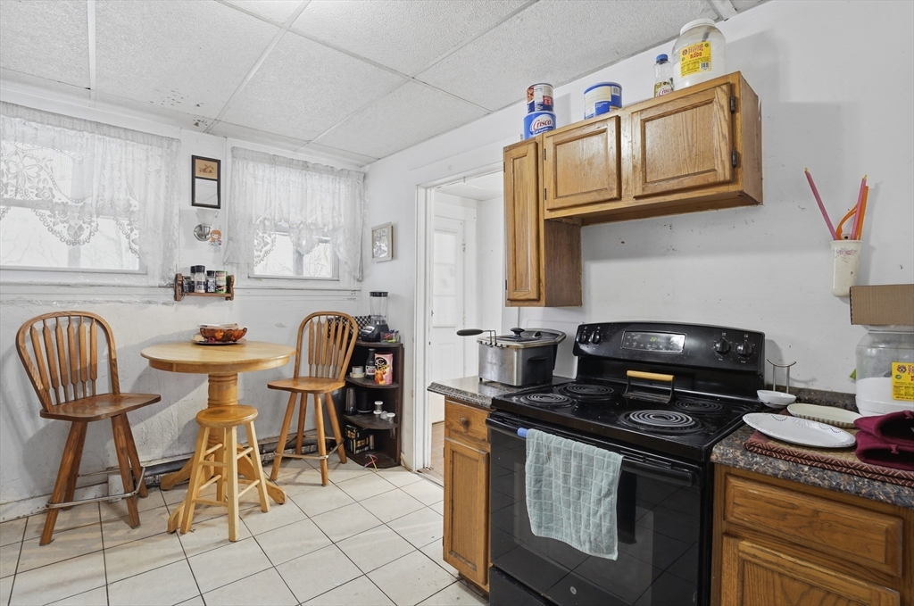 52-56 Green Street Athol, MA 01331 - Photo 13 of 41 a kitchen with stainless steel appliances granite countertop a stove a sink and a microwave